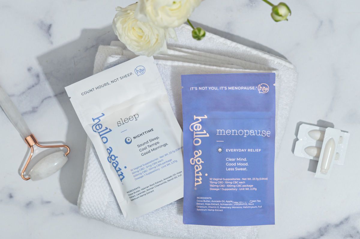Hello Again Sleep and Menopause products sitting on top of a towel on top of a white granite countertop