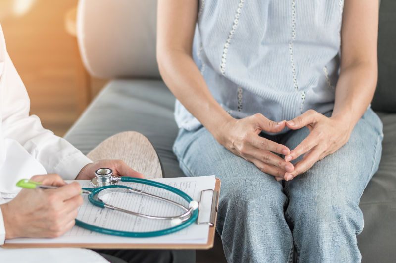 Woman talking with doctor