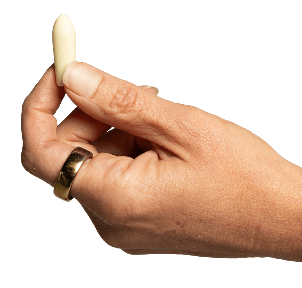 Hand holding a suppository