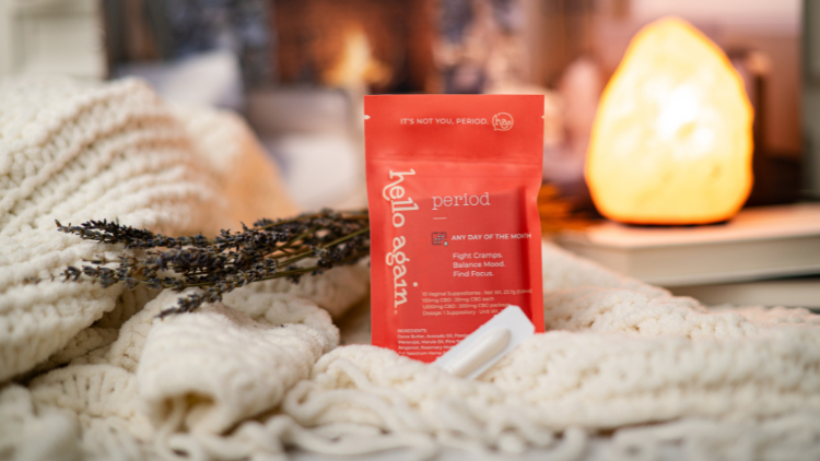 Hello Again Period product sits in a warm cozy blanket ready for cramps two weeks before your period.