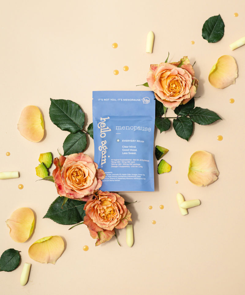 Menopause Product next to flowers and leaves