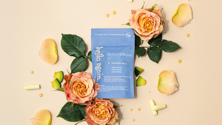 Hello Again Menopause product next to flowers and suppositories.