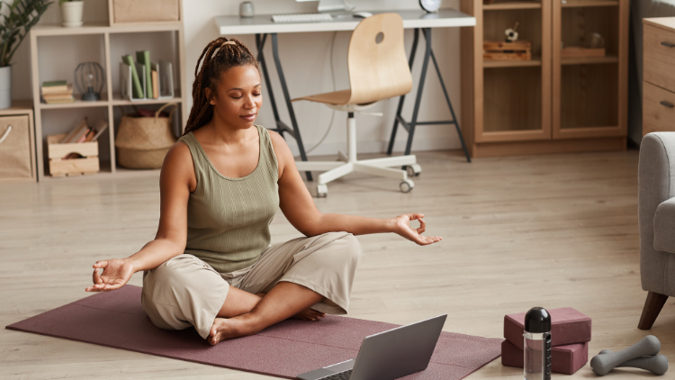 Woman meditating at home as part of a healthy lifestyle that supports hormone balance and women's health in your 40s.