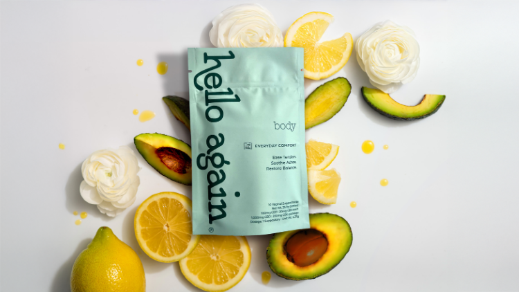 Hello Again Body CBD + CBG suppositories surrounded by avocado, lemon, and white flowers.